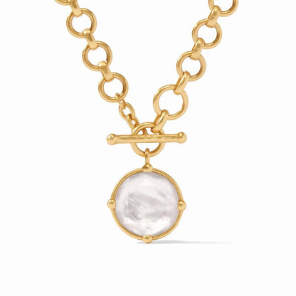 Gold chain necklace with a toggle clasp and a round white gemstone pendant.
