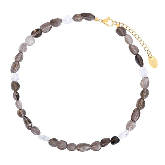 Necklace with oval, dark and clear beads, gold clasp and chain.