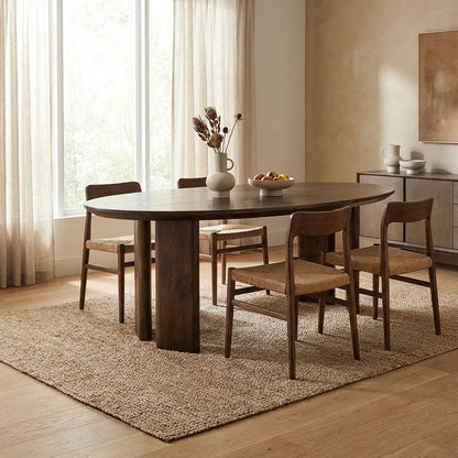 Round wooden table with thick, sturdy legs.