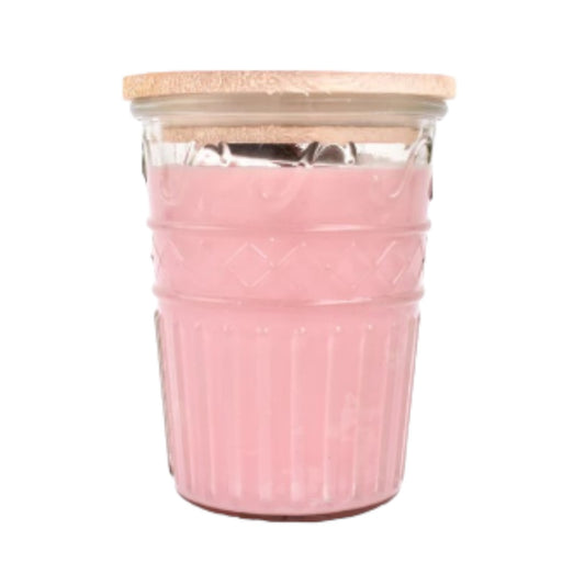 Glass jar with pink contents and a wooden lid.