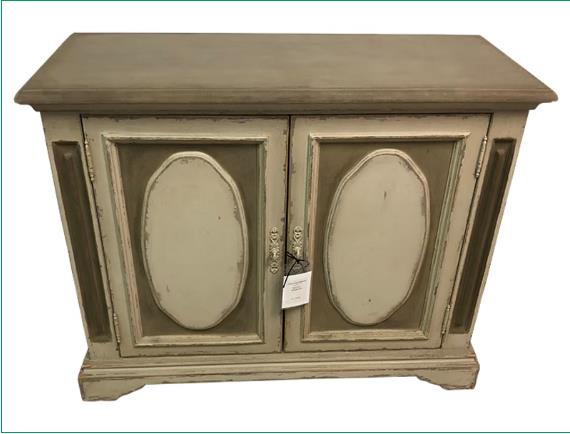 Vintage wooden cabinet with a distressed finish and ornate detailing.