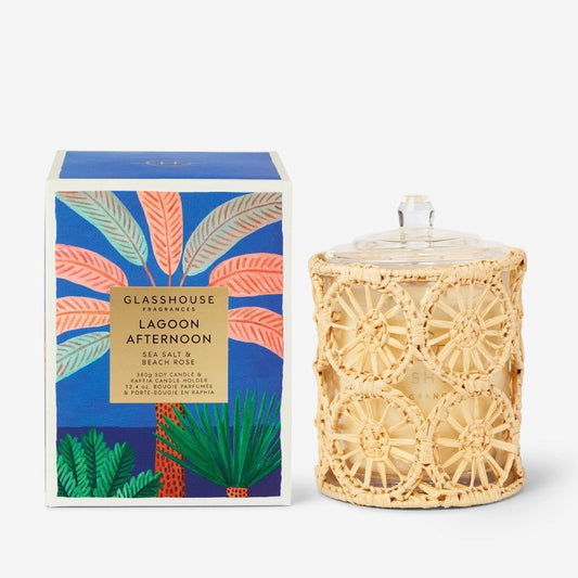 Colorful boxed candle with woven holder, inspired by sea salt and beach rose scents.
