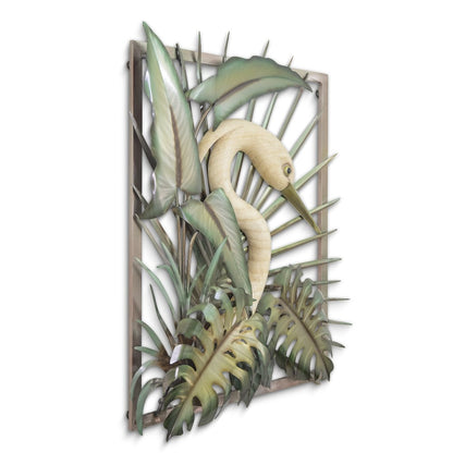 Metallic sculpture of a bird amid tropical leaves.