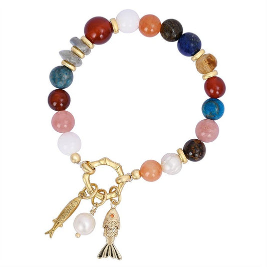 Colorful beaded bracelet with gold charms.