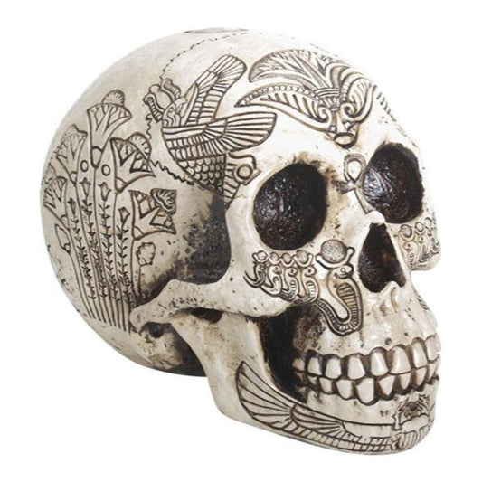 Decorative skull with intricate engraved patterns and floral designs.