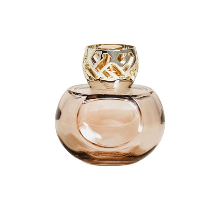 Elegant glass bottle with ornate gold cap.