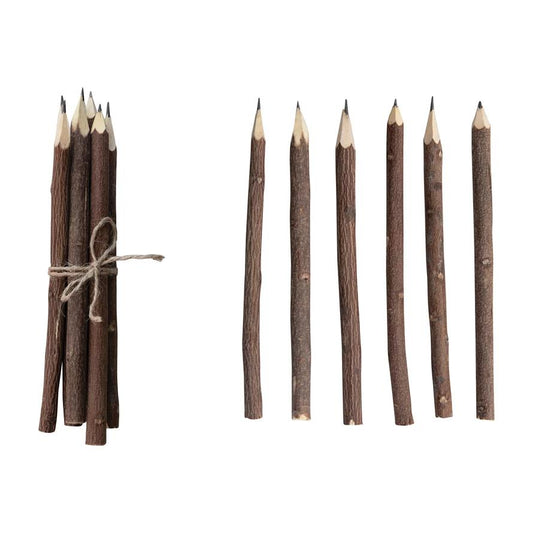 Wooden twig pencils, some tied, some separated.