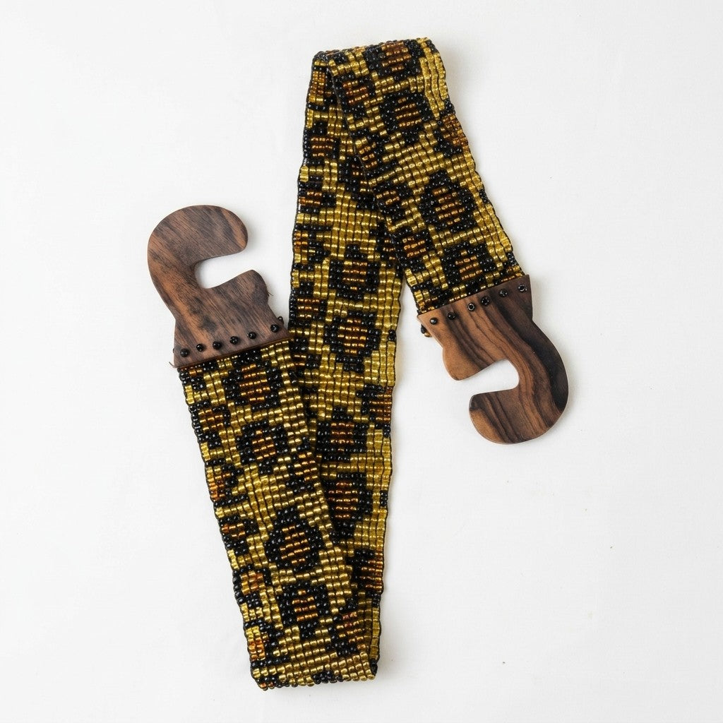 Beaded yellow and black guitar strap with wooden ends.