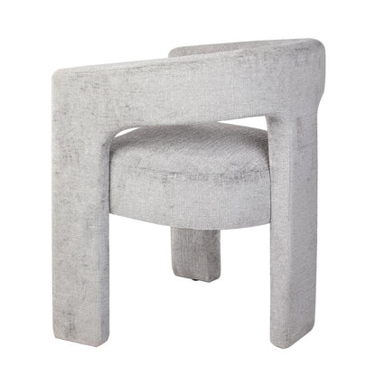 Modern gray chair with curved back and plush seat.