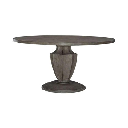 Round wooden pedestal table with a rustic finish.