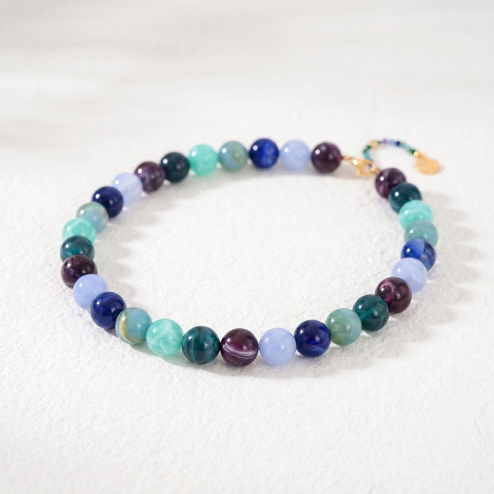 Colorful beaded bracelet on a light surface.