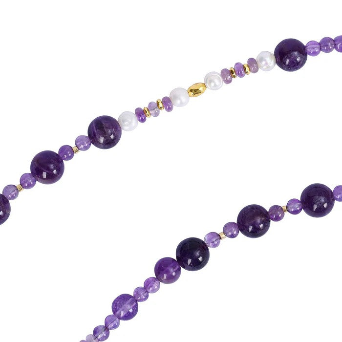 Purple and white beaded necklace with gold accents.