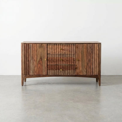 Wooden sideboard with fluted design and brass knobs on a neutral background.