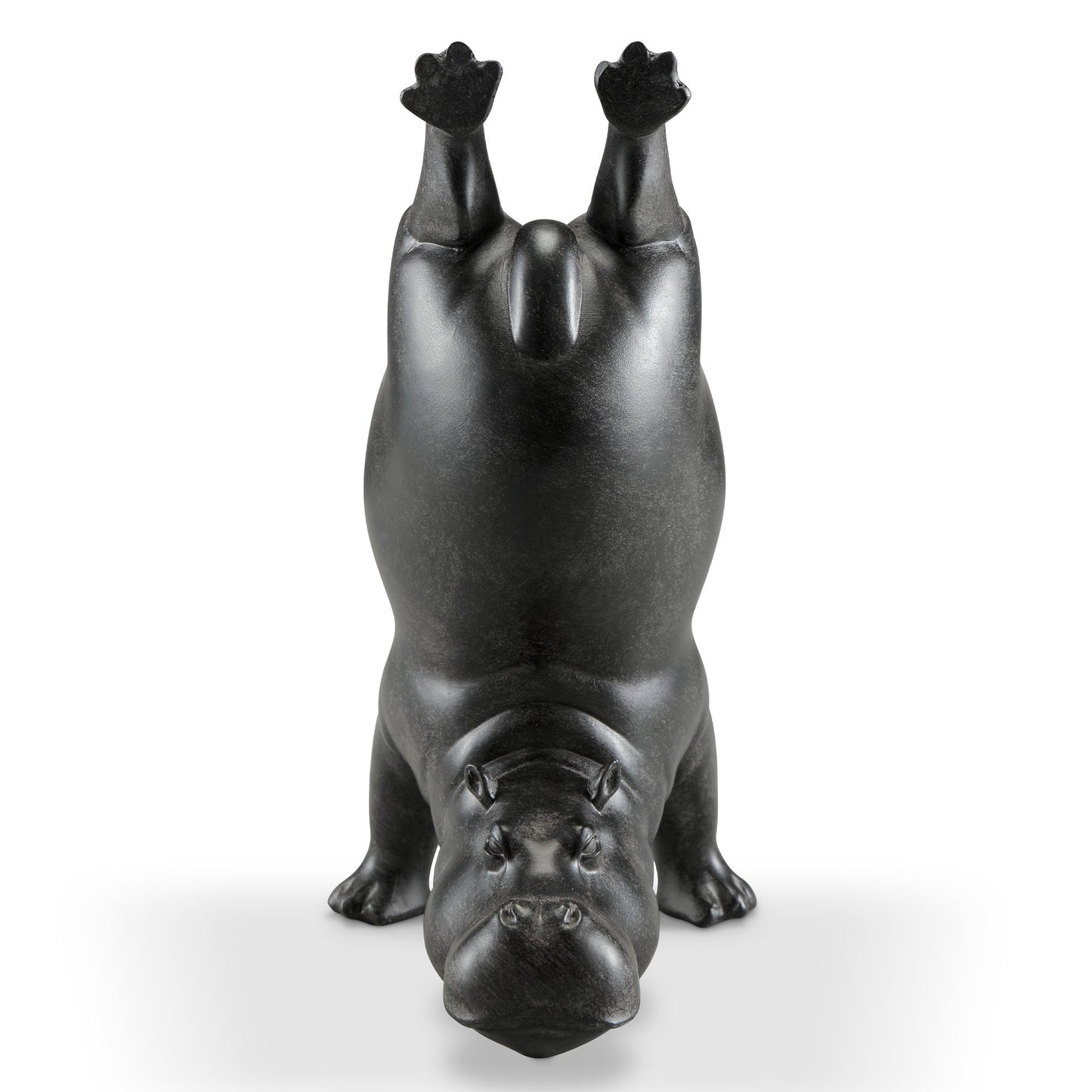Upturned hippo statue performing a handstand.