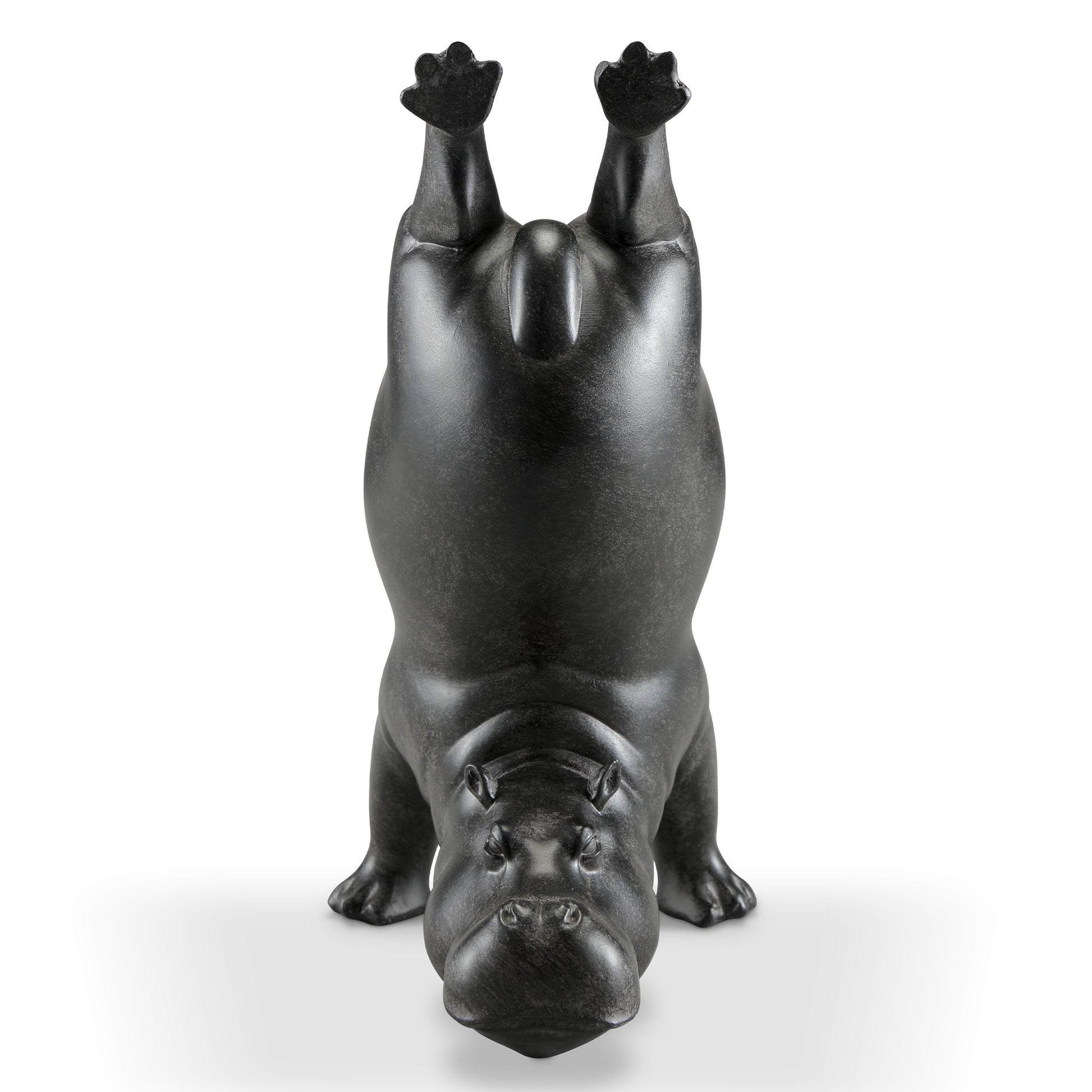 Upturned hippo statue performing a handstand.