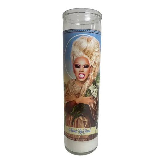 Decorative candle with a drag queen image labeled "Saint RuPaul."