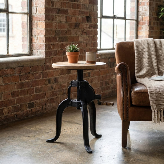 Industrial-style stool with adjustable wooden seat and metal base.