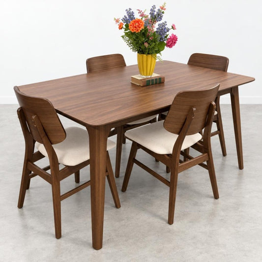 Wooden dining set with a vase of colorful flowers.