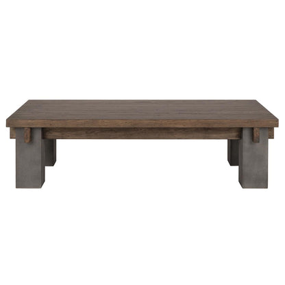 Wooden table with concrete legs, minimalist design.