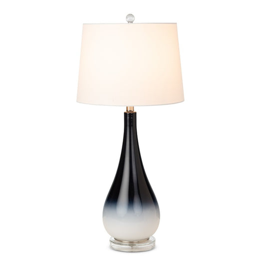 Elegant lamp with gradient black to white base and white shade.
