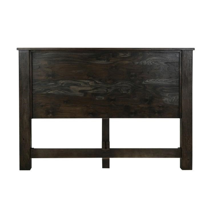 Dark wooden headboard with visible grain patterns.