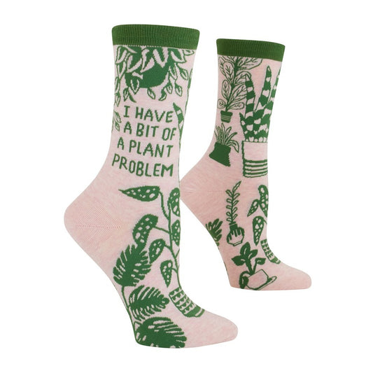 Pink socks with green plant designs and text about a plant hobby.