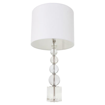 Modern lamp with a white shade and a stacked glass sphere base.
