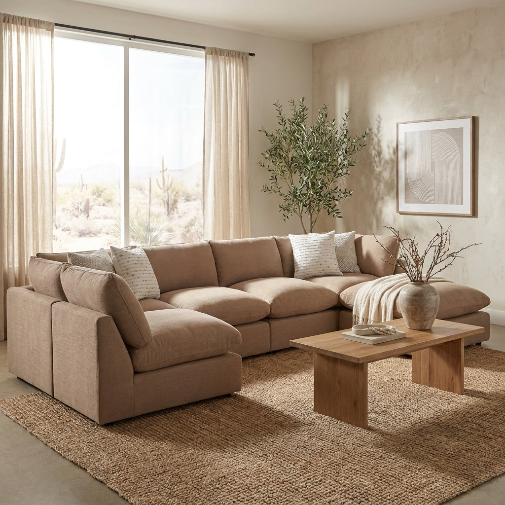 Brown L-shaped sectional sofa with white pillows.