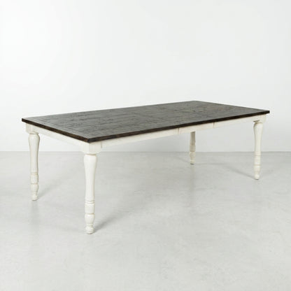 Rustic wood dining table with white legs.