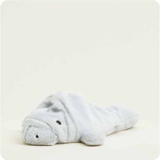 Soft light gray plush manatee on a plain background.