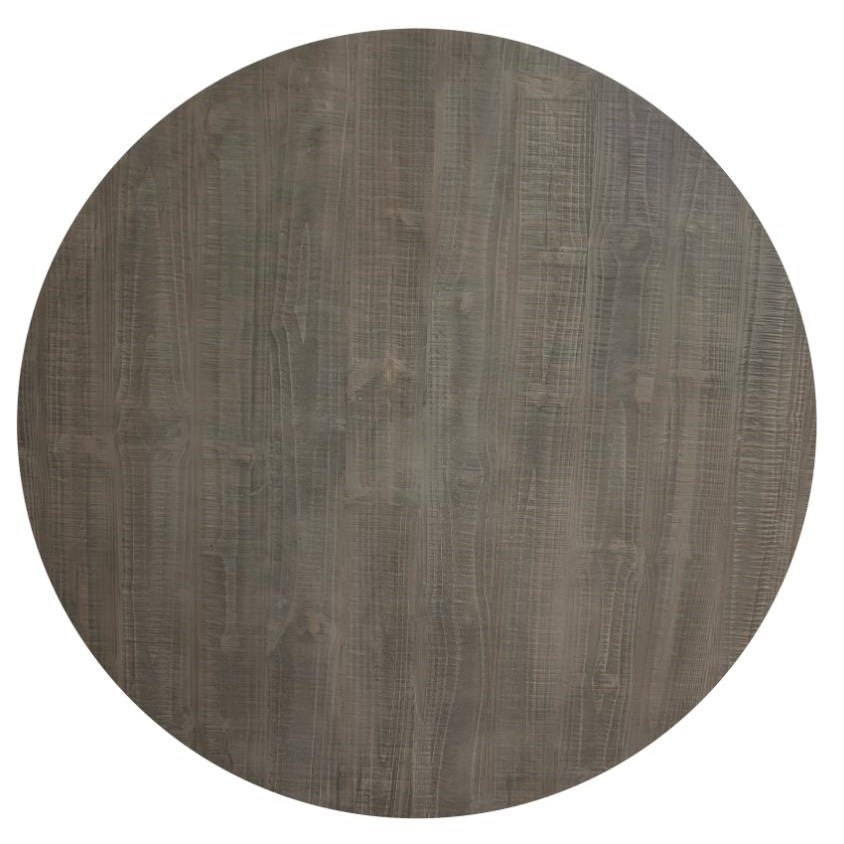 Round wooden table top with a textured surface.