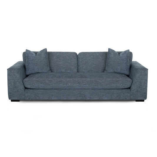Modern blue sofa with two matching cushions.