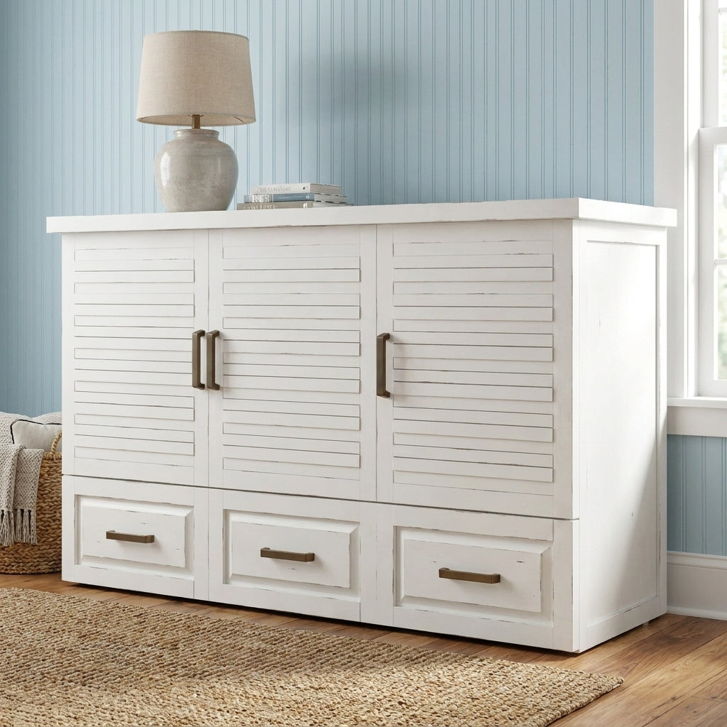 White cabinet with drawers and a lamp, against a light blue wall.