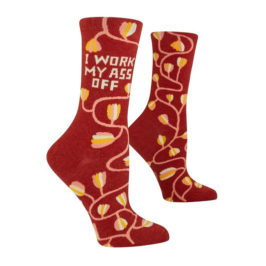 Red socks with flowers and text: "I work my ass off."