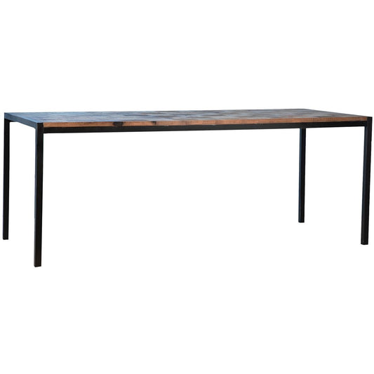 Minimalist table with wooden top and metal legs.