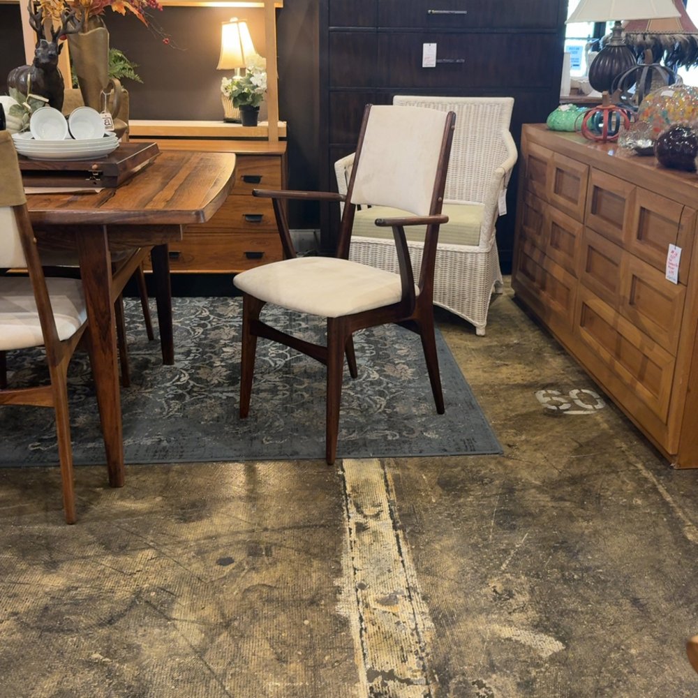 Vintage dining room setup with wooden furniture and decor.