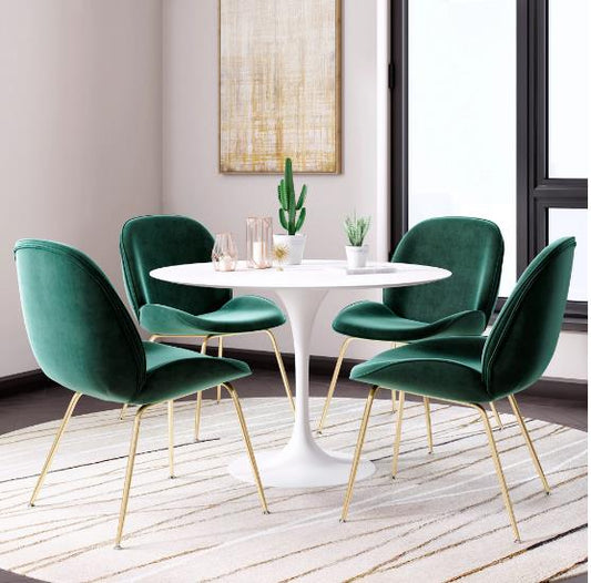 Modern dining setup with green chairs, white table, and decor on a light rug.