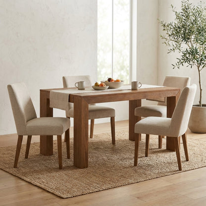 Simple wooden table with four sturdy legs.