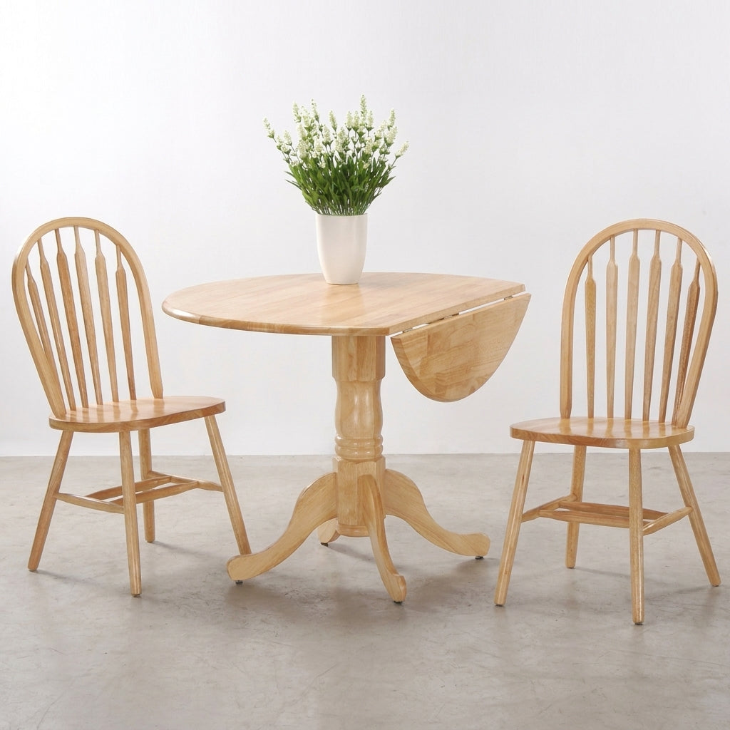Wooden dining set with vase of flowers on round table, two chairs beside it.