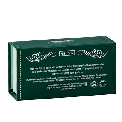 Green soap box with decorative text and floral accents.