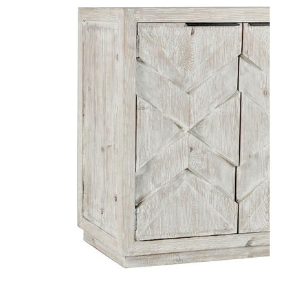 Rustic whitewashed wooden cabinet with geometric patterns.