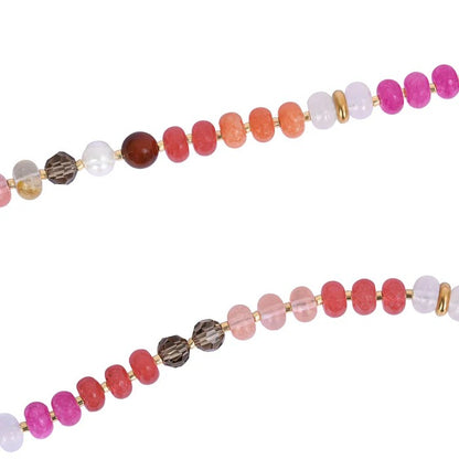 Colorful beaded necklaces with gold accents on white background.