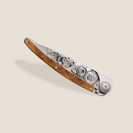 Folding knife with a wooden handle and intricate metalwork.