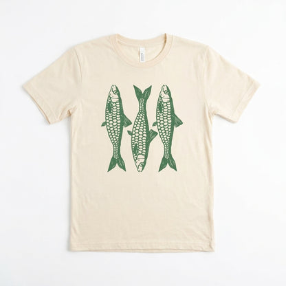 Beige T-shirt featuring three green fish illustrations.