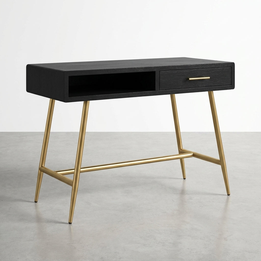 Black desk with gold legs and a drawer, on a gray floor.