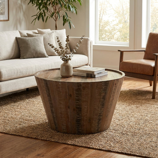 Round wooden coffee table with a rustic finish.