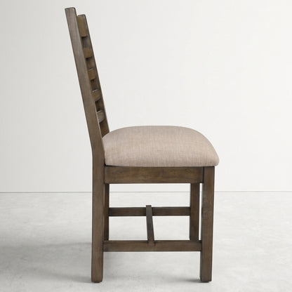 Wooden chair with a cushioned beige seat, side view.