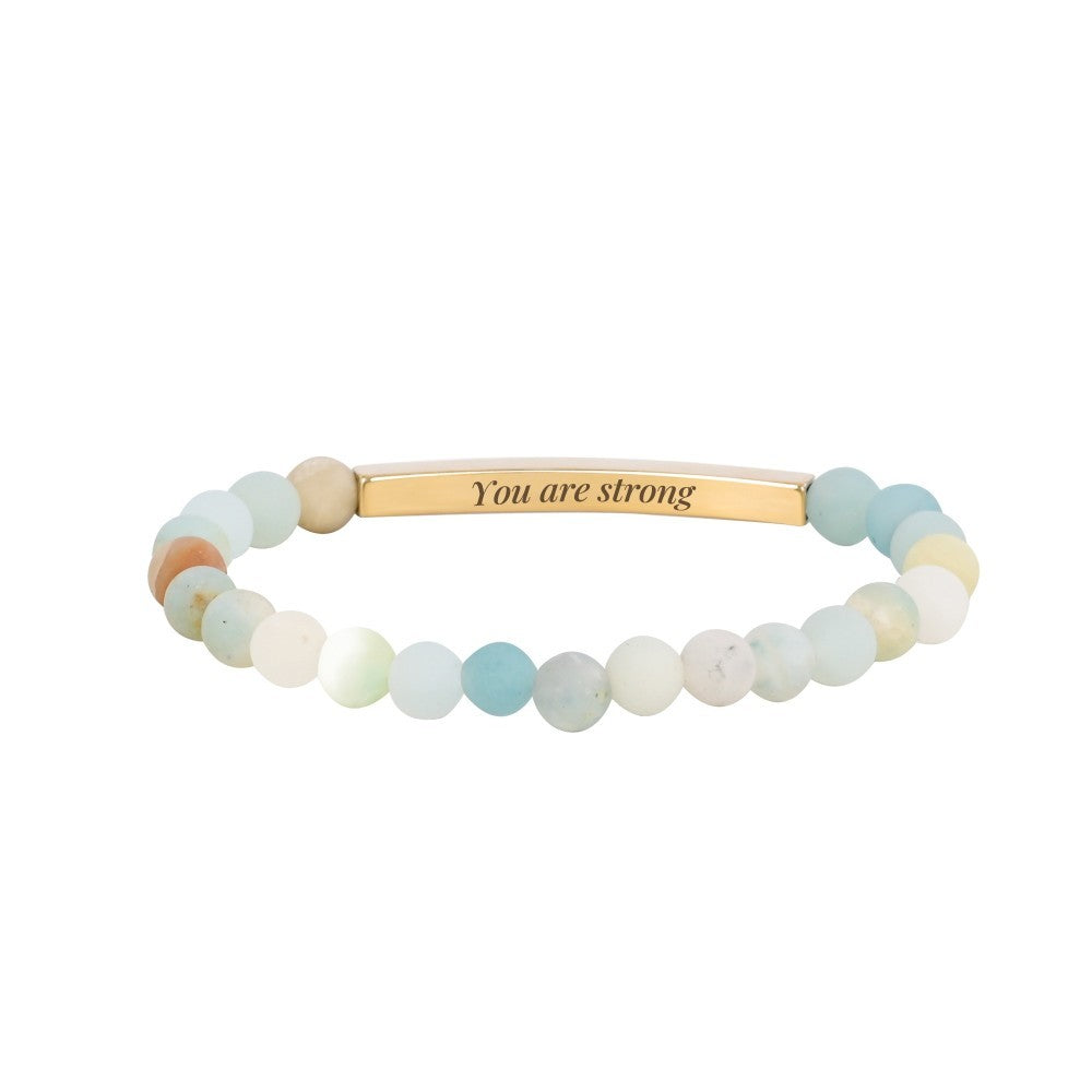 Beaded bracelet with motivational "You are strong" message.