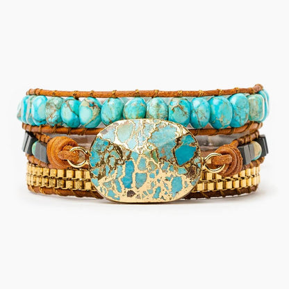 Layered bracelet with turquoise stones and gold accents.