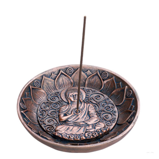 Ornate incense holder with Buddha design in a lotus motif.